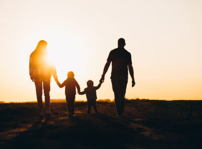 Happy family silhouette on the sunset